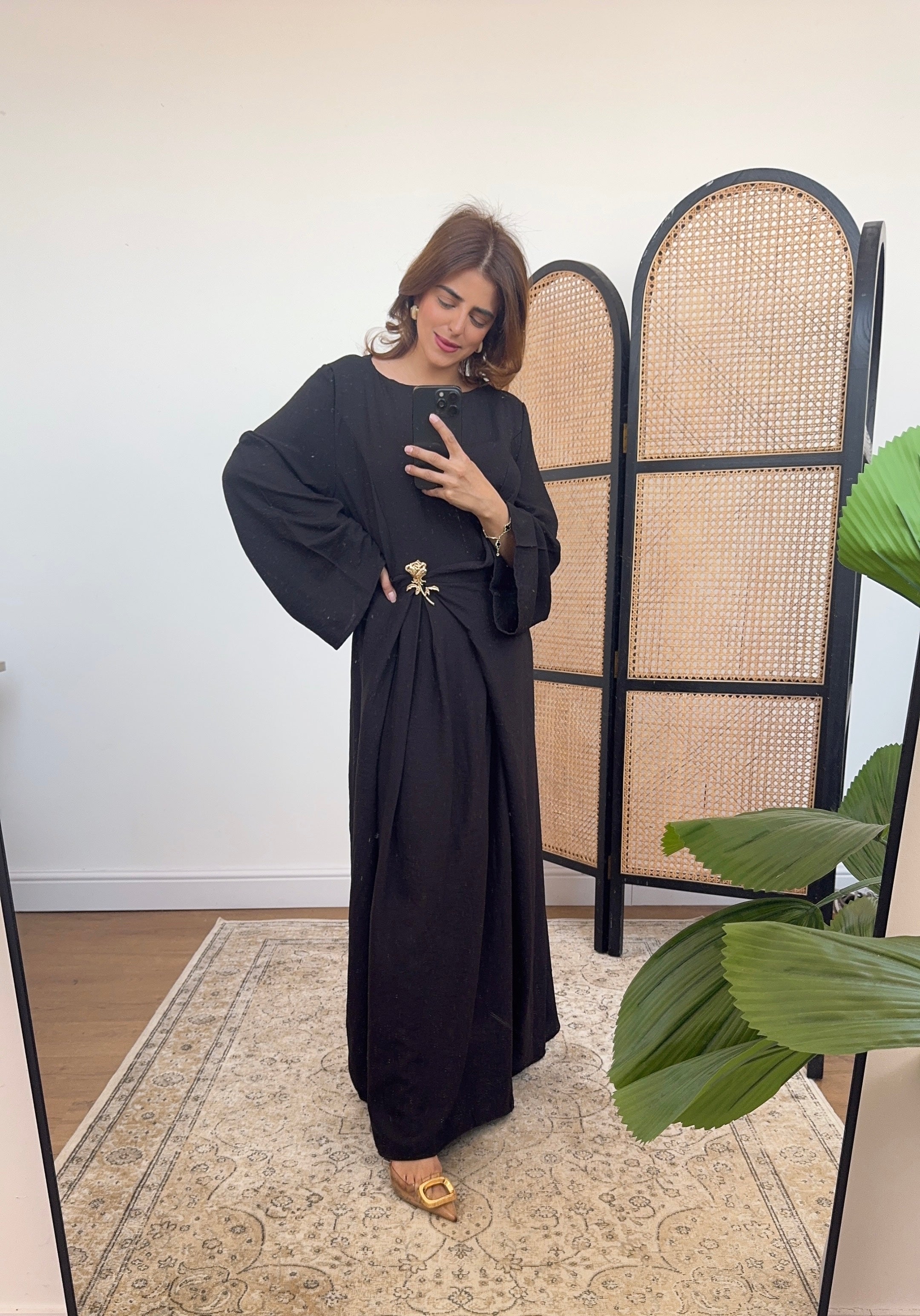 Black dress with gold brooch- gia